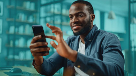 Male scrolling on his phone.